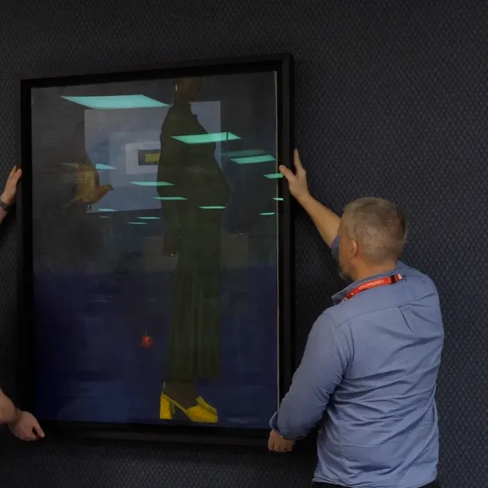 Fine art logistics team installing artwork
